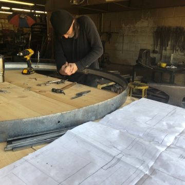 Joe Kelly fabricating an iron chandelier